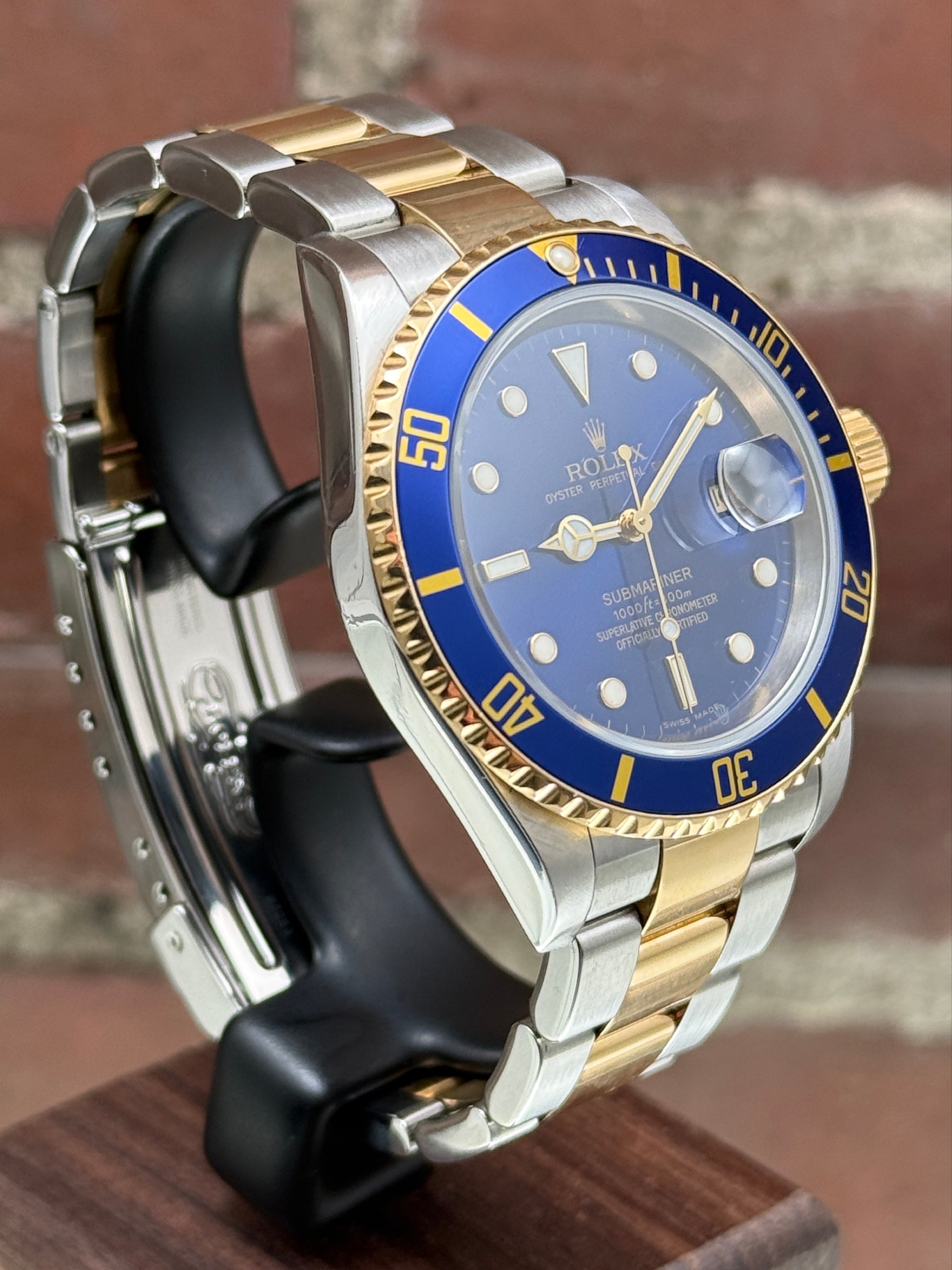 Pre-owned Rolex Submariner Date "Bluesy" 16613 | Gold and steel Blue