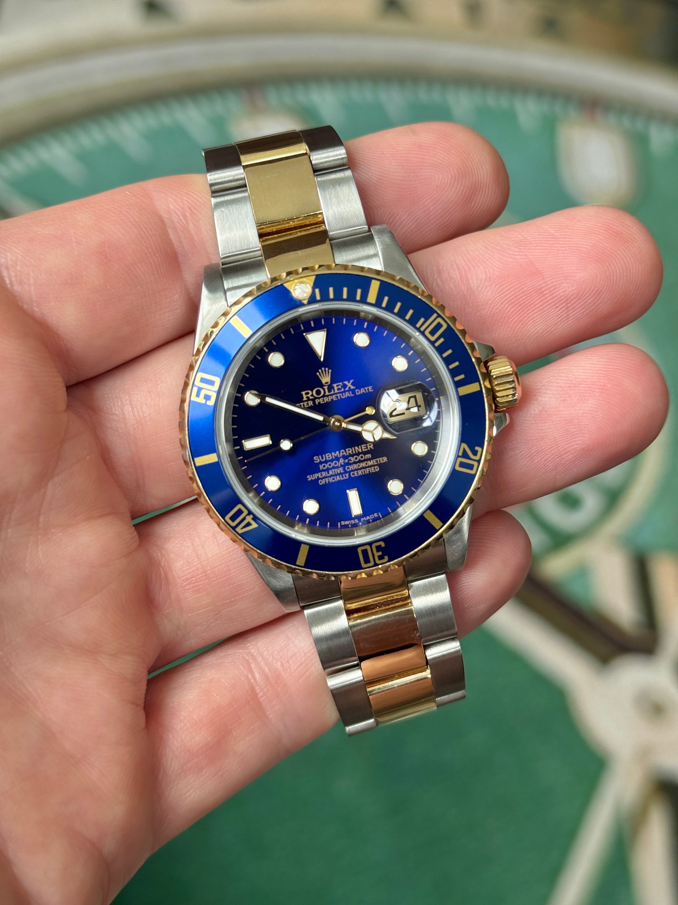 Pre-owned Rolex Submariner 16613 | Gold and steel Blue