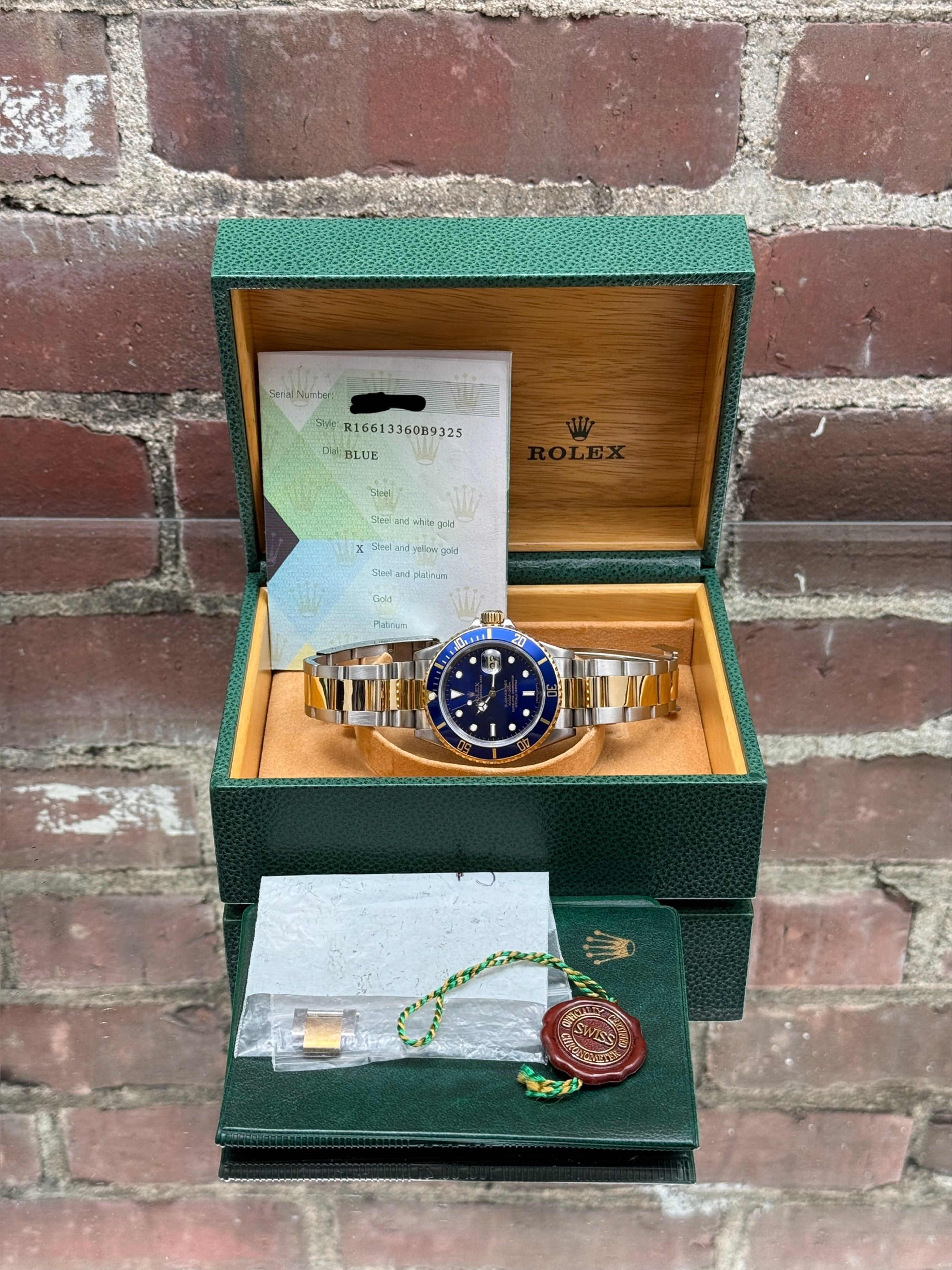 Pre-owned Rolex Submariner 16613 | Gold and steel Blue