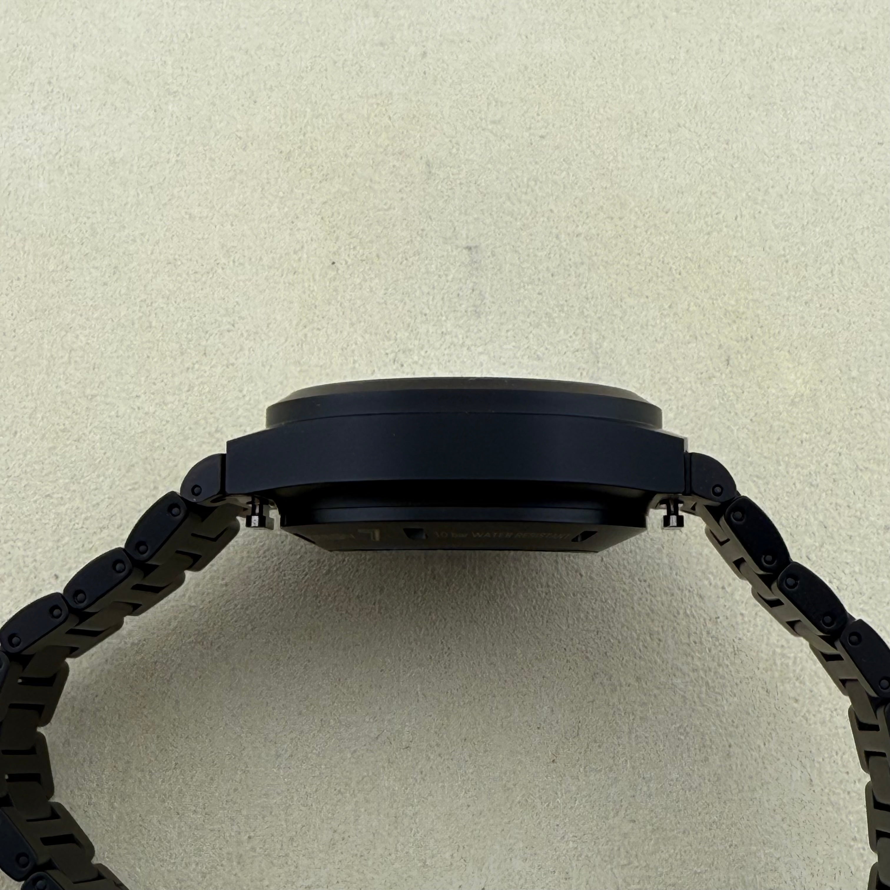 Porsche Design Chronograph 1 Rennsport Reunion 7 Edition Black Titanium Black dial with with white index hour markers and luminous black hands. Three black chronograph sub-dials. Day & date windows at 3 o’clock. Dial 6041.7.01.004.01.5